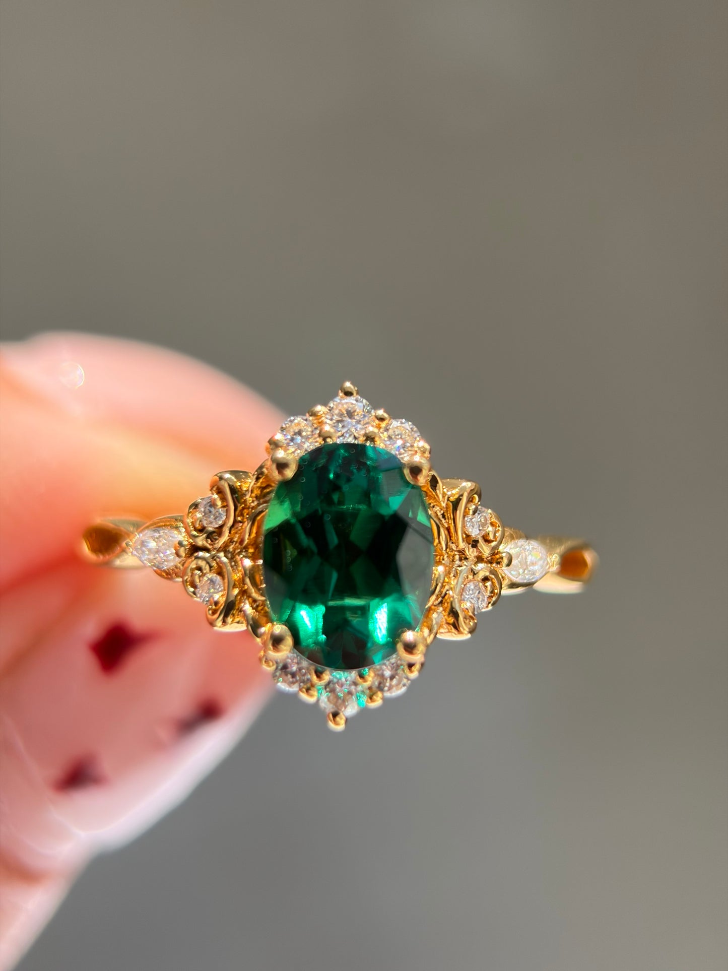 Forest Empress Non-traditional Engagement Ring with oval lab emerald 18k gold