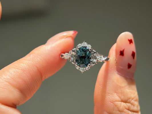 Abyss Crown Non-traditional Engagement Ring with oval lab green sapphire 14K gold