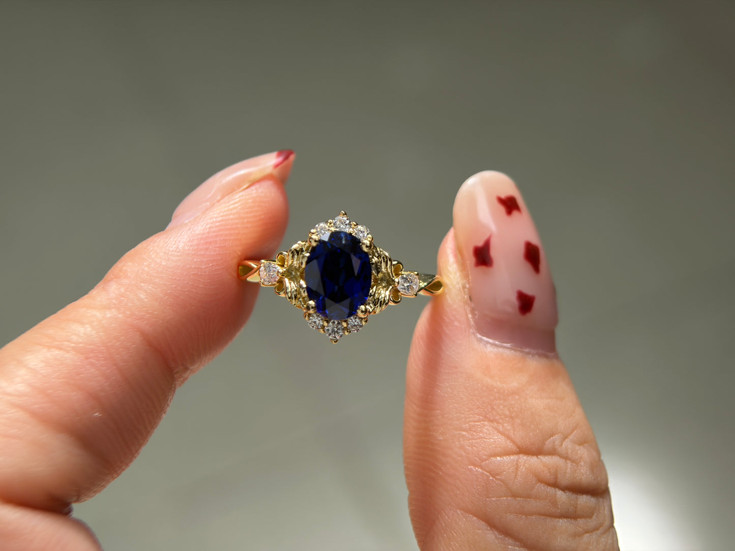 Abyss Crown Non-traditional Engagement Ring with oval lab blue sapphire 14K gold