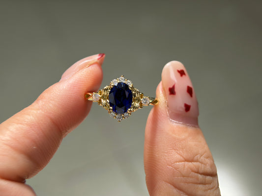 Abyss Crown Non-traditional Engagement Ring with oval lab blue sapphire 14K gold