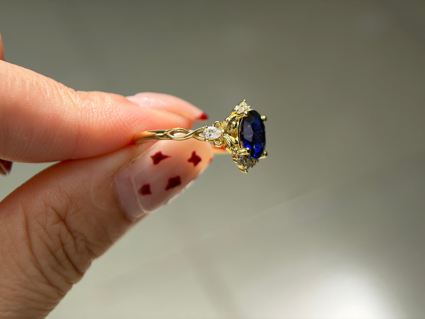 Abyss Crown Non-traditional Engagement Ring with oval lab blue sapphire 14K gold