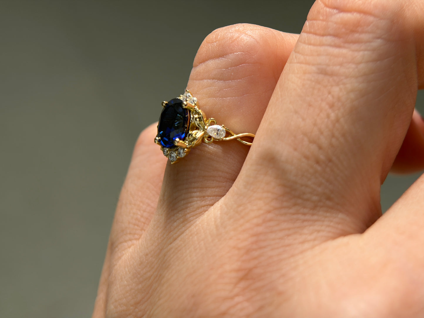Abyss Crown Non-traditional Engagement Ring with oval lab blue sapphire 14K gold