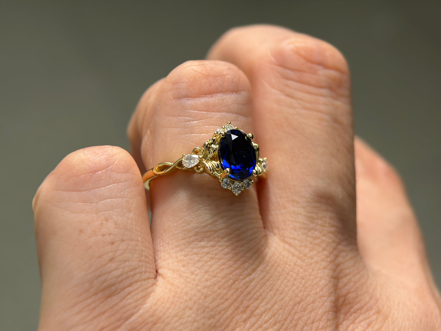 Abyss Crown Non-traditional Engagement Ring with oval lab blue sapphire 14K gold